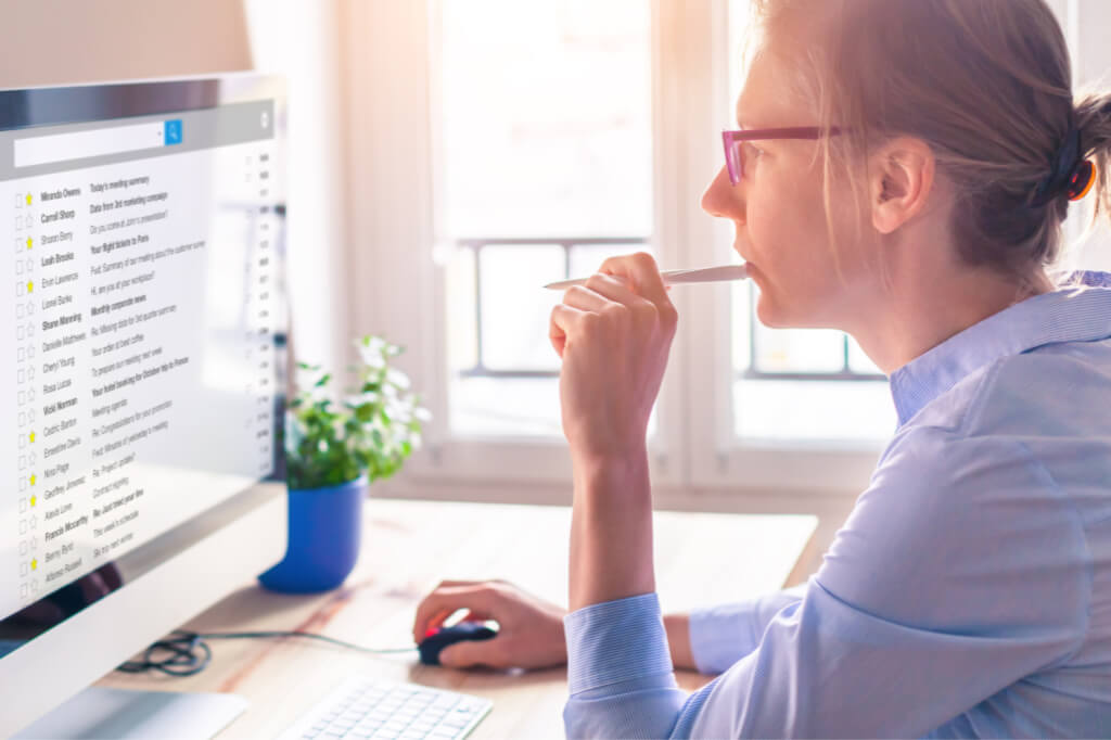 Automate your life by setting email filters. This woman is processing her emails.