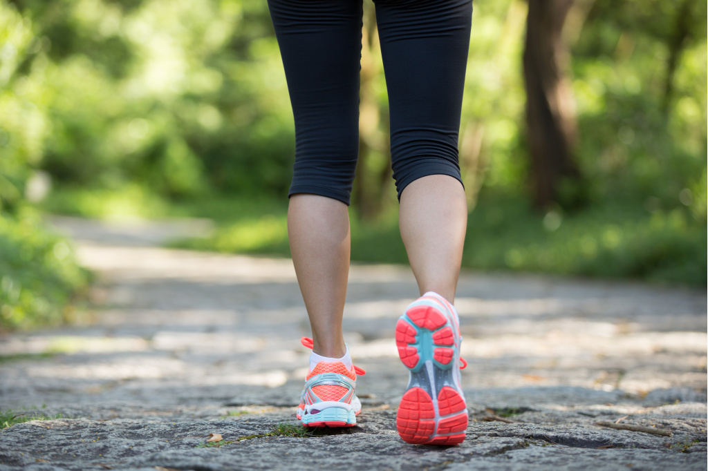 Woman taking a break and going on a walk. Highly productive people take breaks.